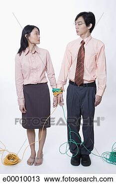 Stock Photo - woman and man 
bound by cables. 
fotosearch - search 
stock photos, 
pictures, images, 
and photo clipart