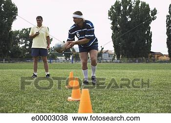 Stock Photo - rugby player practicing. 
fotosearch - search 
stock photos, 
pictures, images, 
and photo clipart
