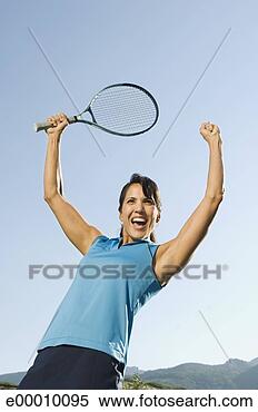 Stock Image - victorious tennis 
player with arms 
raised. fotosearch 
- search stock 
photos, pictures, 
images, and photo 
clipart