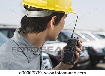 Stock Photograph - worker with walkie 
talkie. fotosearch 
- search stock 
photos, pictures, 
images, and photo 
clipart