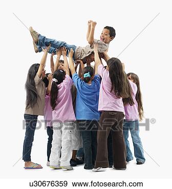 Stock Photograph - children lifting 
one child. fotosearch 
- search stock 
photos, pictures, 
wall murals, images, 
and photo clipart