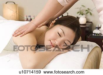 Stock Photograph - one woman having 
massage, side 
view, japan. fotosearch 
- search stock 
photos, pictures, 
images, and photo 
clipart