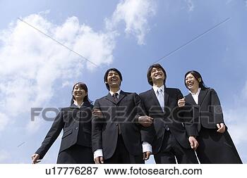 Picture - young business 
people standing 
side by side under 
the blue sky, 
 arm. fotosearch 
- search stock 
photos, pictures, 
images, and photo 
clipart