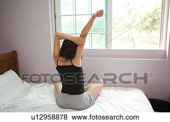 Stock Photo - stretching, orient, 
morning, woman, 
black hair, bed, 
couple. fotosearch 
- search stock 
photos, pictures, 
images, and photo 
clipart