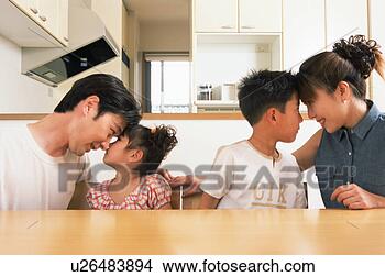 Stock Photo - side view of parents 
having eye contact 
with their two 
children. fotosearch 
- search stock 
photos, pictures, 
images, and photo 
clipart