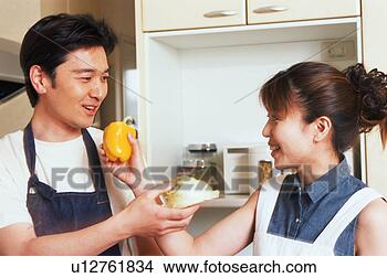 Stock Photo - a woman giving 
a bell pepper 
to her husband 
while the husband 
gives. fotosearch 
- search stock 
photos, pictures, 
images, and photo 
clipart