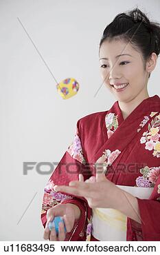 Stock Image - yukata woman who 
plays with the 
bean-bag the bean-bag. 
fotosearch - search 
stock photos, 
pictures, images, 
and photo clipart
