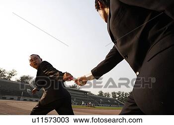 Stock Photo - business men passing 
the red baton 
in relay race. 
fotosearch - search 
stock photos, 
pictures, images, 
and photo clipart