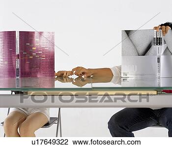 Stock Photo - young lovers handing 
behind book. fotosearch 
- search stock 
photos, pictures, 
images, and photo 
clipart