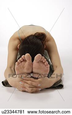 Stock Photography - view of a young 
woman exercising 
on the floor. 
fotosearch - search 
stock photos, 
pictures, images, 
and photo clipart