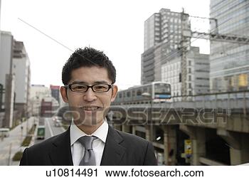 Stock Photography - close-up of a 
businessman wearing 
spectacles. fotosearch 
- search stock 
photos, pictures, 
images, and photo 
clipart