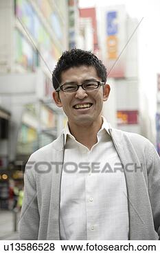 Stock Photo - close-up of a 
young man wearing 
glasses. fotosearch 
- search stock 
photos, pictures, 
images, and photo 
clipart