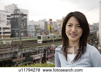 Stock Photo - portrait of a 
smiling young 
woman. fotosearch 
- search stock 
photos, pictures, 
images, and photo 
clipart
