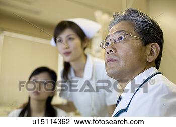 Stock Photo - doctor examining 
patient. fotosearch 
- search stock 
photos, pictures, 
images, and photo 
clipart