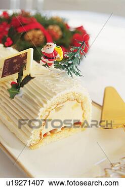 Picture - christmas cake 
rolled up and 
covered with cream, 
yolu log. fotosearch 
- search stock 
photos, pictures, 
images, and photo 
clipart