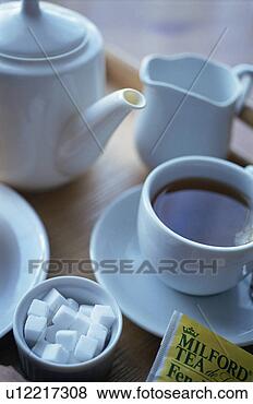 Stock Photo - tea cup on a tray. 
fotosearch - search 
stock photos, 
pictures, images, 
and photo clipart
