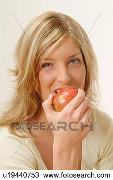 Stock Photo - portrait of woman 
eating apple, 
biting off. fotosearch 
- search stock 
photos, pictures, 
images, and photo 
clipart