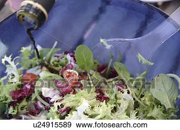 Stock Photograph - preparing fresh 
salad: adding 
vinegar. fotosearch 
- search stock 
photos, pictures, 
images, and photo 
clipart