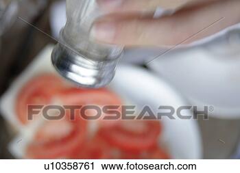 Stock Photography - salting tomatoes, 
blurry, close 
up. fotosearch 
- search stock 
photos, pictures, 
images, and photo 
clipart