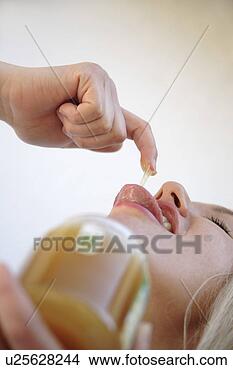 Stock Photo - young blond woman 
licking honey 
off her finger, 
 view fron below. 
fotosearch - search 
stock photos, 
pictures, images, 
and photo clipart