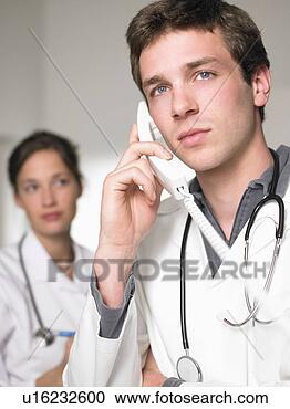 Stock Photography - doctor on the 
phone, portrait. 
fotosearch - search 
stock photos, 
pictures, images, 
and photo clipart