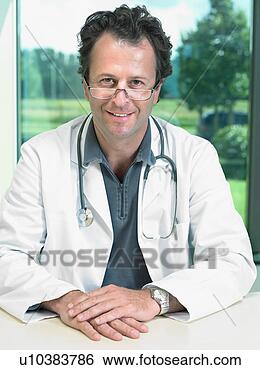 Stock Photo - portrait of mature 
male doctor. fotosearch 
- search stock 
photos, pictures, 
images, and photo 
clipart
