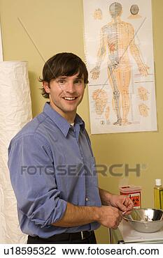 Stock Photo - doctor of chinese 
medicine in office. 
fotosearch - search 
stock photos, 
pictures, images, 
and photo clipart