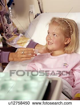 Stock Photography - nurse helping 
little girl. fotosearch 
- search stock 
photos, pictures, 
images, and photo 
clipart