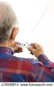 Stock Photo - back over the 
shoulder view 
of caucasion elderly 
man holding. fotosearch 
- search stock 
photos, pictures, 
images, and photo 
clipart