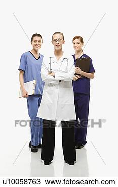 Stock Photo - full-length portrait 
of caucasian women 
healthcare workers 
in. fotosearch 
- search stock 
photos, pictures, 
images, and photo 
clipart
