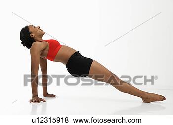 Stock Photo - profile of african 
american young 
adult woman exercising 
in strength. fotosearch 
- search stock 
photos, pictures, 
images, and photo 
clipart