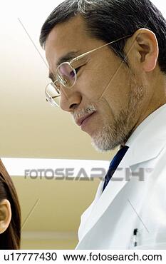 Stock Photography - two scientists 
talking in laboratory 
in laboratory, 
 close up,  low. 
fotosearch - search 
stock photos, 
pictures, images, 
and photo clipart