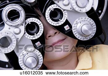 Stock Image - girl getting vision 
tested. fotosearch 
- search stock 
photos, pictures, 
images, and photo 
clipart