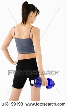 Banco de Imagem - mulher,  segurando, 
 dumbbell,  parte 
traseira,  vista. 
fotosearch - busca 
de fotos, imagens 
e clipart