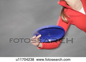 Banco de Imagem - mulher,   tocando, 
  frisbee,   jogar, 
  pegando,   frente, 
  escuro. fotosearch 
- busca de fotos, 
imagens e clipart