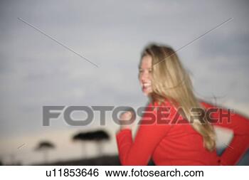 Stock Photo - upper part of 
woman's body jogging 
at the beach, 
side view. fotosearch 
- search stock 
photos, pictures, 
images, and photo 
clipart