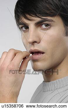 Stock Photo - ill young man 
taking a pill. 
fotosearch - search 
stock photos, 
pictures, images, 
and photo clipart