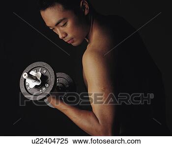 Stock Image - young man exercising 
with dumbbell. 
fotosearch - search 
stock photos, 
pictures, images, 
and photo clipart