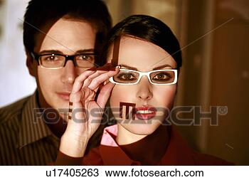 Stock Photo - woman wearing 
eyeglasses with 
optical exam characters 
on her face and. 
fotosearch - search 
stock photos, 
pictures, images, 
and photo clipart