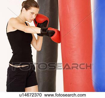 Stock Photography - a young woman 
boxing. fotosearch 
- search stock 
photos, pictures, 
images, and photo 
clipart