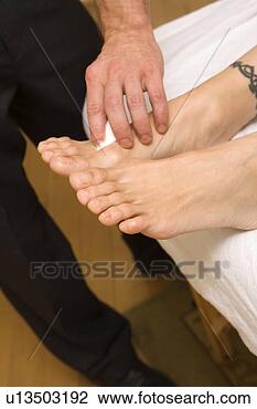 Stock Photo - doctor treating 
patient with chinese 
medicine. fotosearch 
- search stock 
photos, pictures, 
images, and photo 
clipart