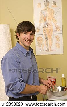 Stock Photography - doctor of chinese 
medicine in office. 
fotosearch - search 
stock photos, 
pictures, images, 
and photo clipart