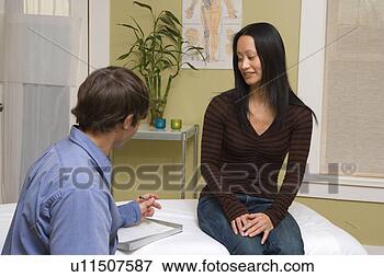 Picture - doctor consulting 
with patient. 
fotosearch - search 
stock photos, 
pictures, images, 
and photo clipart