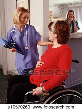Stock Photography - nurse and pregnant 
lady in wheelchair. 
fotosearch - search 
stock photos, 
pictures, images, 
and photo clipart