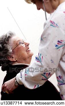 Stock Photo - woman having a 
medical checkup. 
fotosearch - search 
stock photos, 
pictures, images, 
and photo clipart
