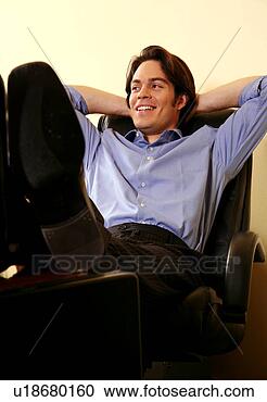 Stock Photography - young businessman 
relaxing with 
hands behind head. 
fotosearch - search 
stock photos, 
pictures, images, 
and photo clipart
