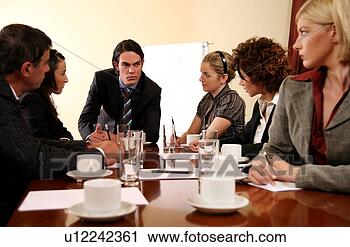 Stock Photography - a group of business 
people at a meeting. 
fotosearch - search 
stock photos, 
pictures, images, 
and photo clipart