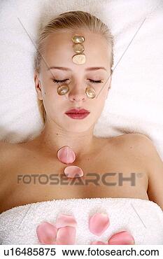 Stock Image - woman having a 
facial treatment 
in a spa. fotosearch 
- search stock 
photos, pictures, 
images, and photo 
clipart