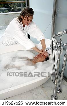 Stock Photo - mature couple 
having fun in 
the bathtub. fotosearch 
- search stock 
photos, pictures, 
images, and photo 
clipart