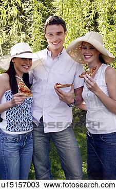 Stock Photo - three friends 
eating pizza. 
fotosearch - search 
stock photos, 
pictures, images, 
and photo clipart